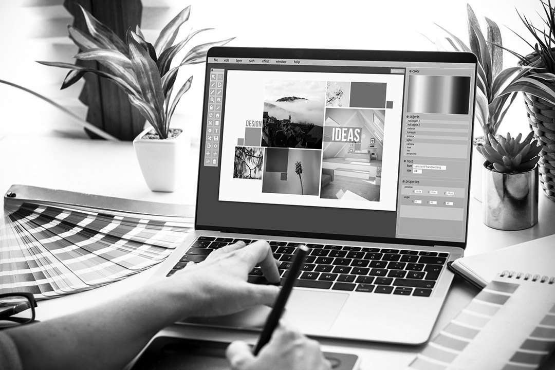 Graphic designer working on a laptop